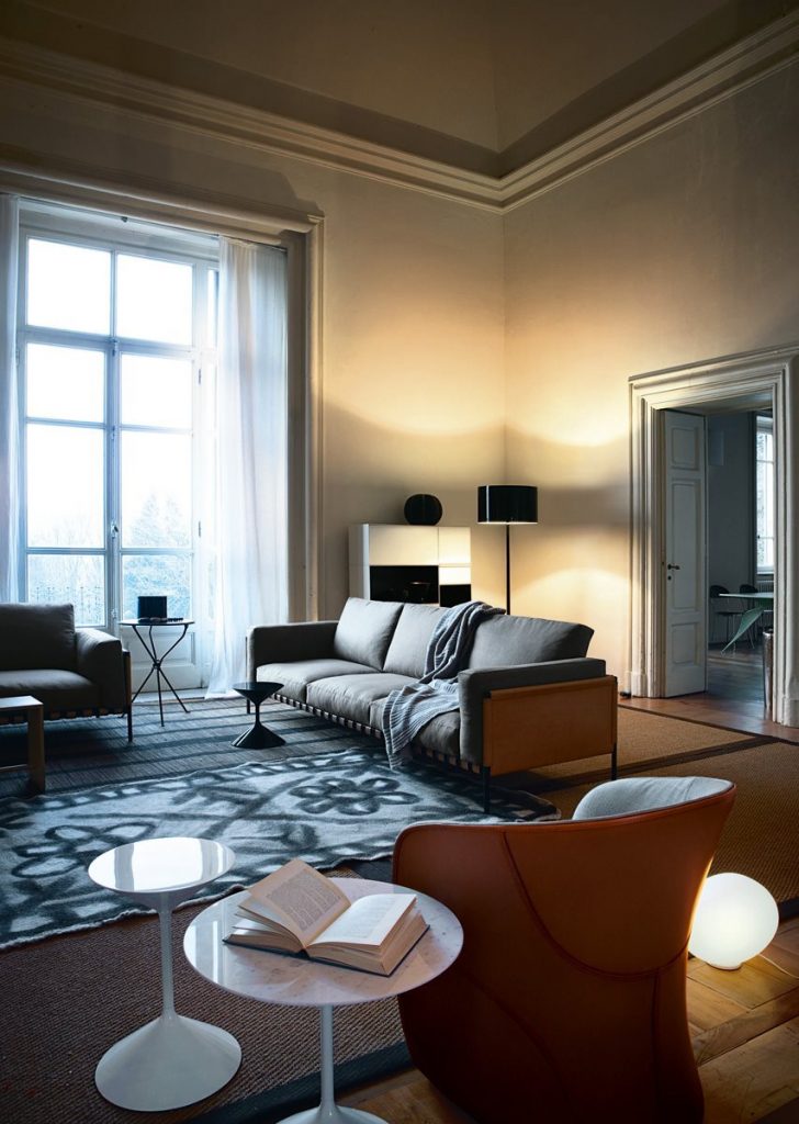 Calla armchair upholstered in brown and white fabric in a living room.