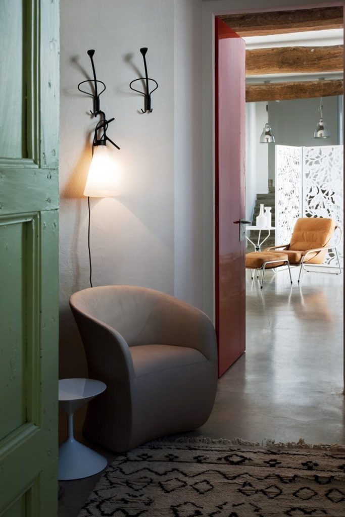 Calla armchair upholstered in brown and white fabric in a living room.