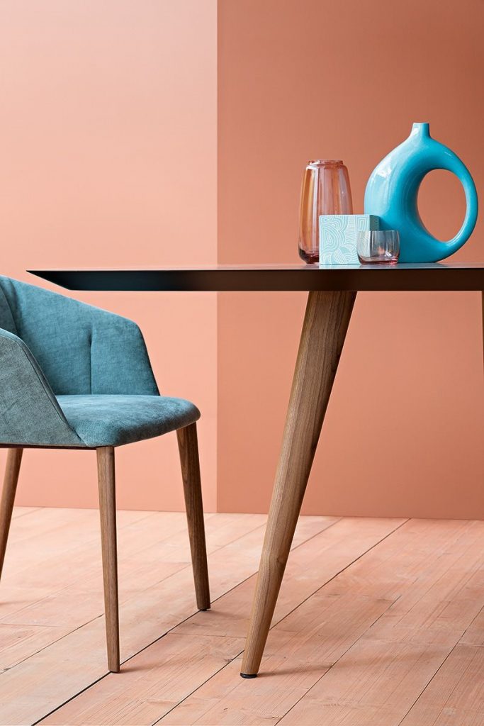 Liza 2271 - 2271R chair featuring a blue cushioned seat, armrest and backrest with four natural wood legs in a dining room.