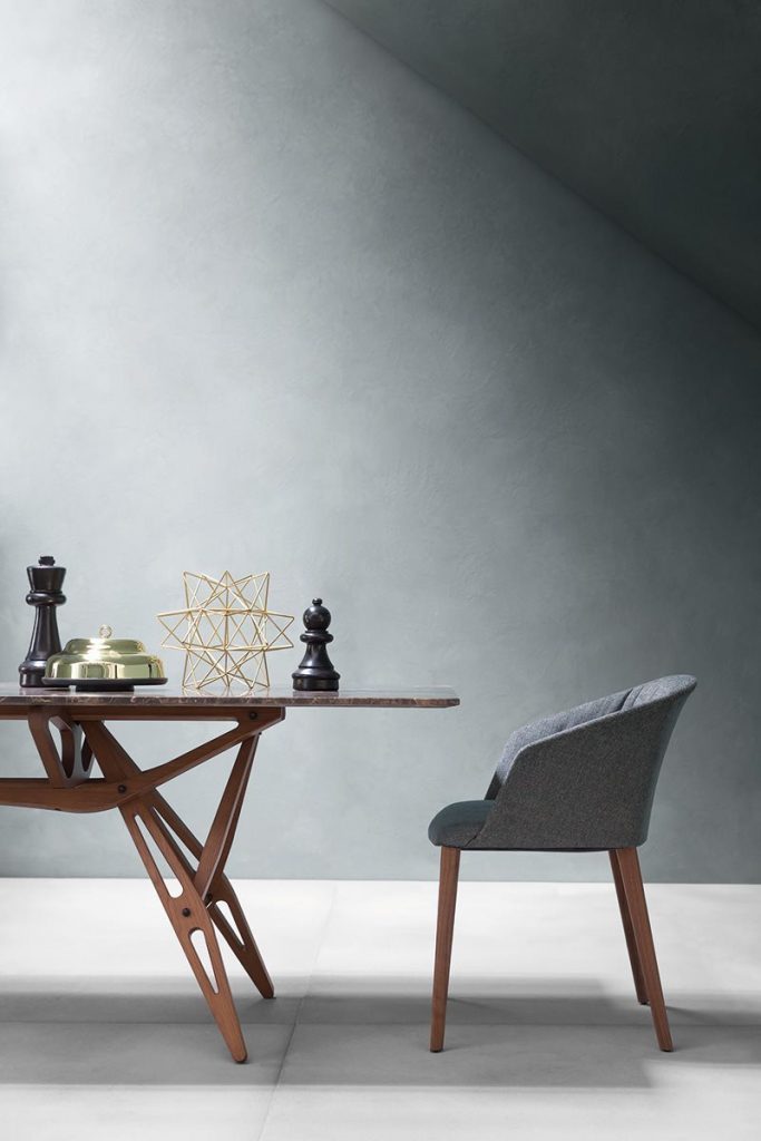 Liza 2271 - 2271R chair featuring a gray cushioned seat, armrest and backrest with four natural wood legs in a dining room.