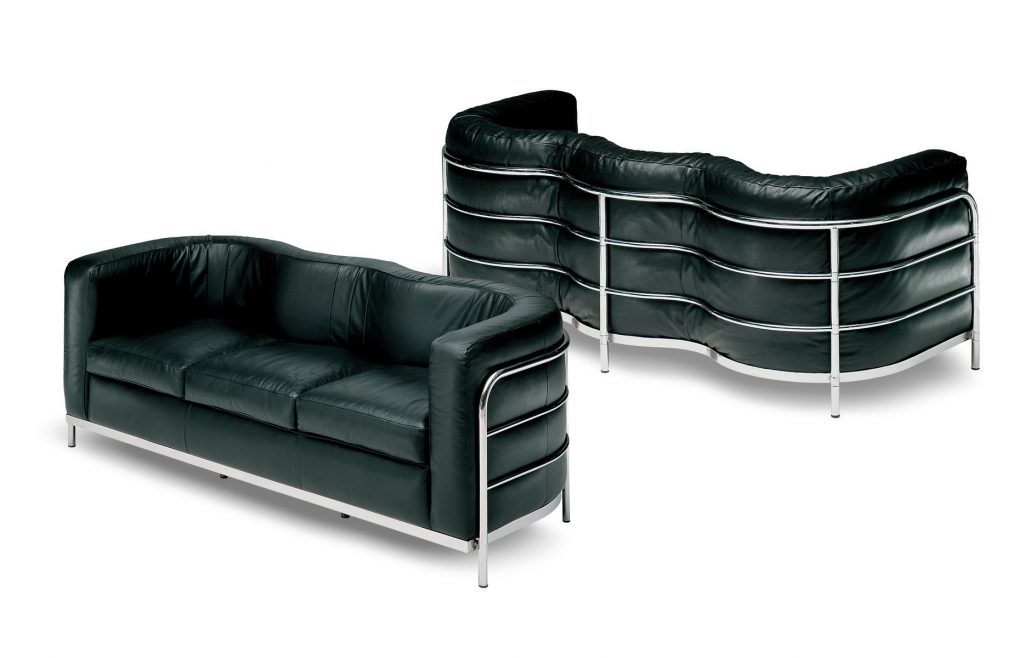 Two Onda sofas featuring a curved seat and backrest upholstered in a black fabric with a steel base on a white background.