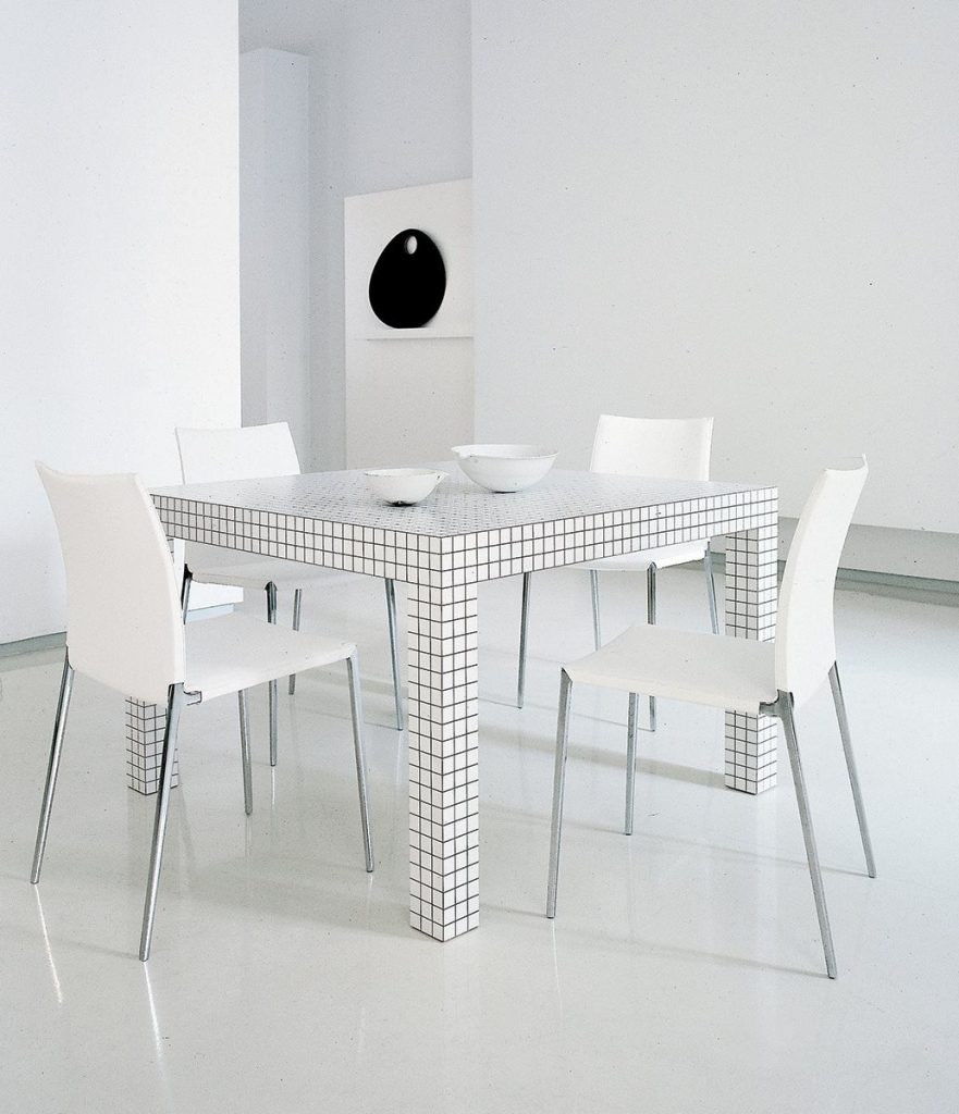 Quaderna 2600 console table with a geometric design and a white grid pattern on all surfaces in a dining room.