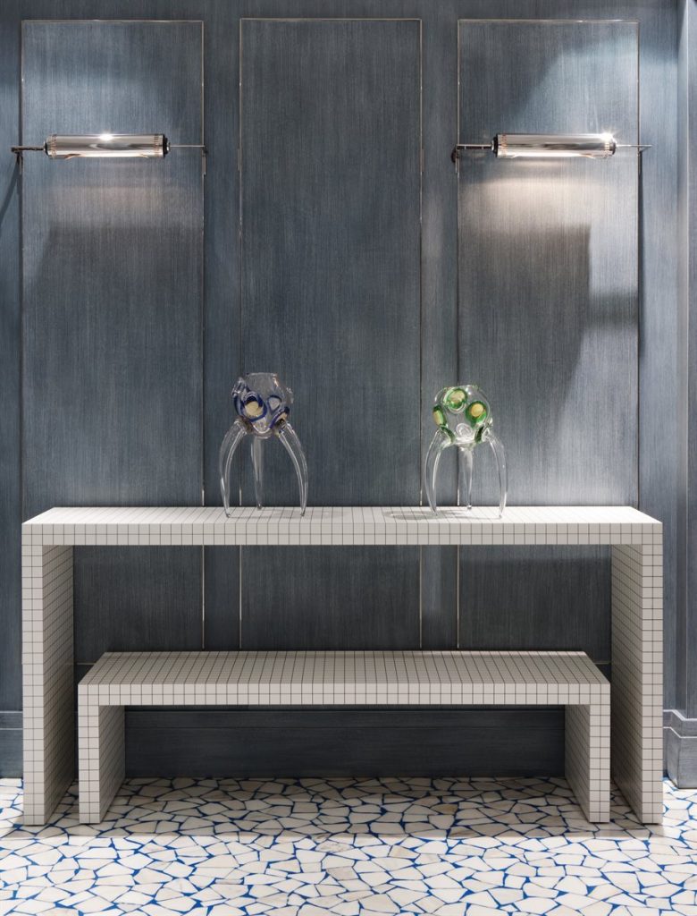 Two Quaderna bench with a rectangle design, featuring a white grid pattern on all surfaces in an entrance hall.