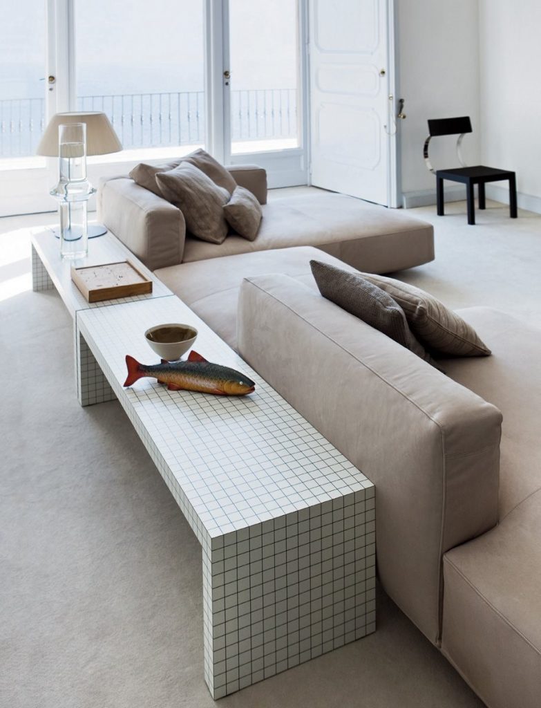 Quaderna bench with a rectangle design and a white grid pattern on all surfaces in a living room.