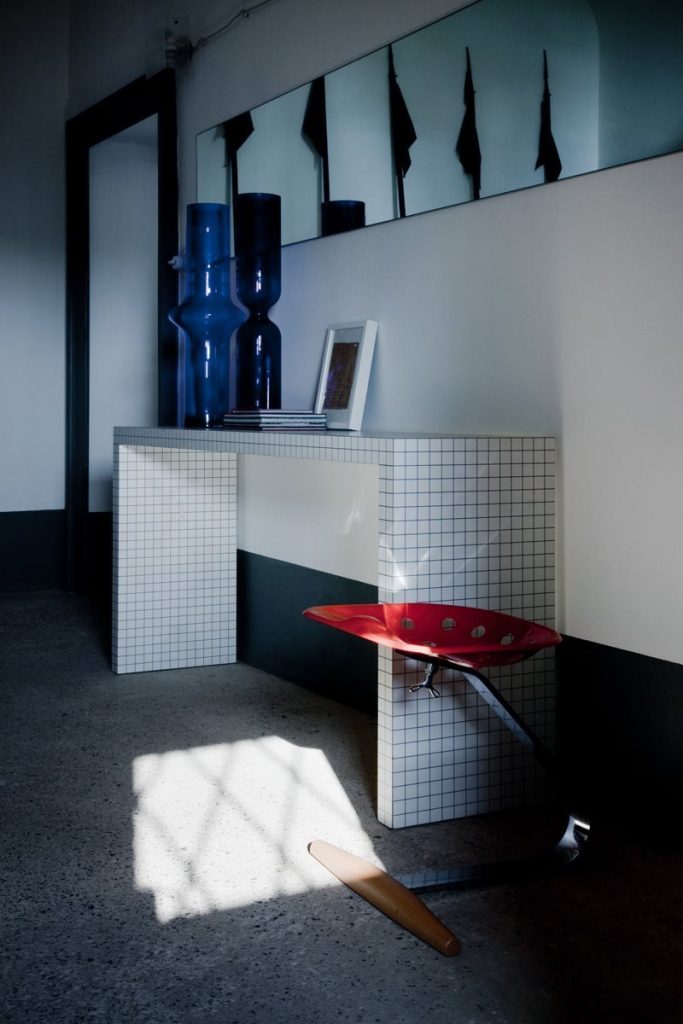 Quaderna bench with a rectangle design, featuring a white grid pattern on all surfaces in an entrance hall.
