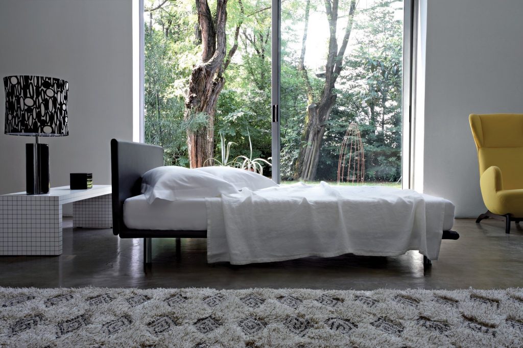 Quaderna bench with a rectangle design, featuring a white grid pattern on all surfaces in bedroom.