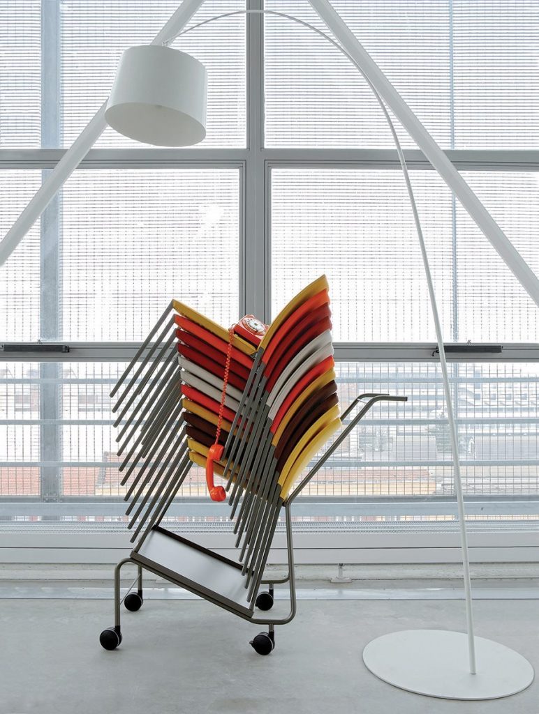 Multicolored Talia 2080 chairs with a metal frame and and backrest in a office.