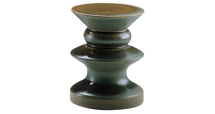 Teti side table with a round black top and a single central metal support, minimalist design on a white background.