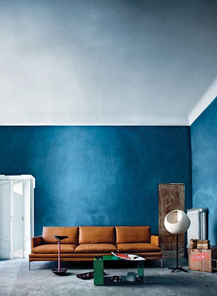 William sofa with a minimalist design, light brown upholstery, and slim metal legs in a living room.