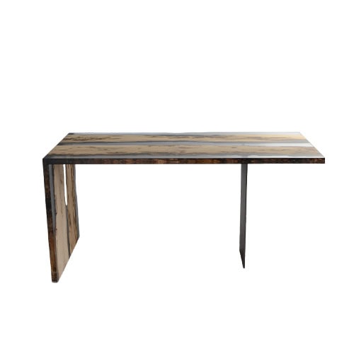 The Bent Desk blends natural wood grain with sleek resin edges, creating a modern silhouette with an asymmetrical base. Both functional and sculptural, it offers a minimalist yet striking workspace design.