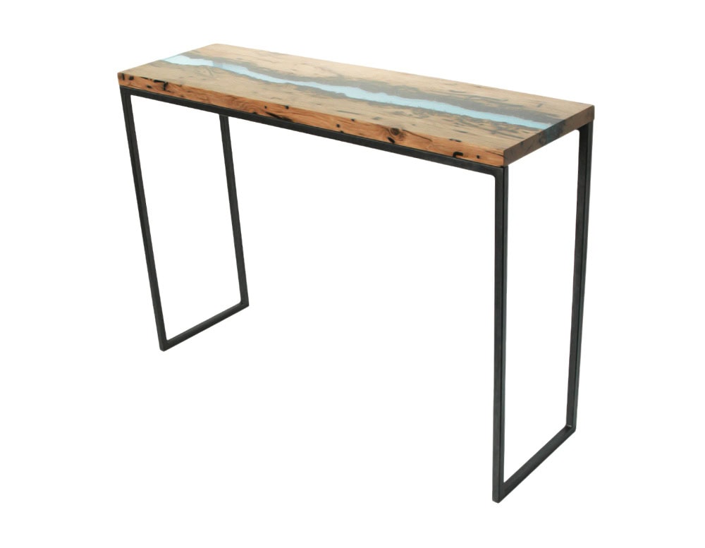 A console table blending reclaimed wood and resin with a river-like flow design. Supported by a sleek black metal frame, it adds a modern touch with natural character.