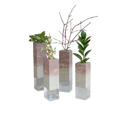 These Dolomyth vases combine natural stone textures with sleek geometric forms. Each piece highlights unique mineral patterns, making them elegant accent accessories for greenery or floral arrangements.