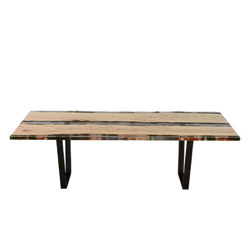 Natural wood dining table with resin inlays preserving live moss details and supported by black steel legs. A design that merges organic textures with modern craftsmanship.