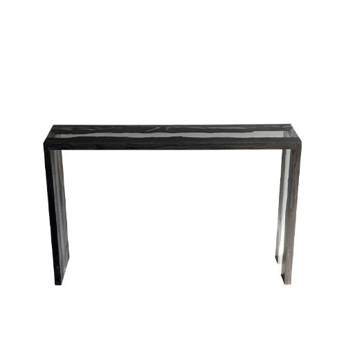 Peatland Console Table combines dark wood with clear resin in a slim rectangular form. The glossy surface and sharp lines create a modern piece with subtle organic depth.