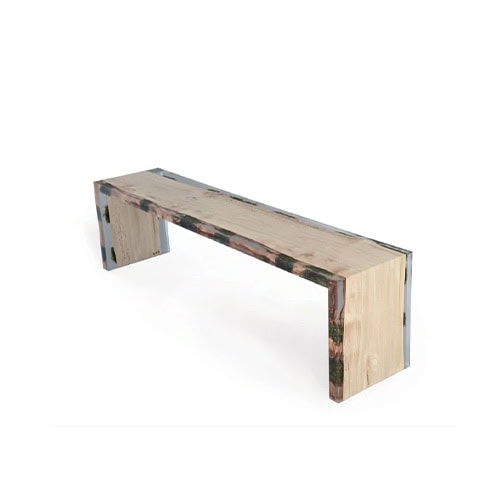 Trail Bench features sleek wood planks framed in clear resin, forming a minimalist silhouette. Its balance of natural texture and modern transparency makes it versatile and sculptural.