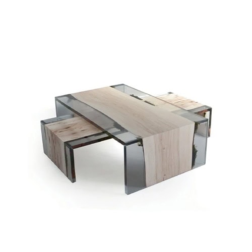 Trail Coffee Table combines light wood with transparent resin, arranged in a layered block design. The clean lines and natural grain create a striking modern centerpiece.