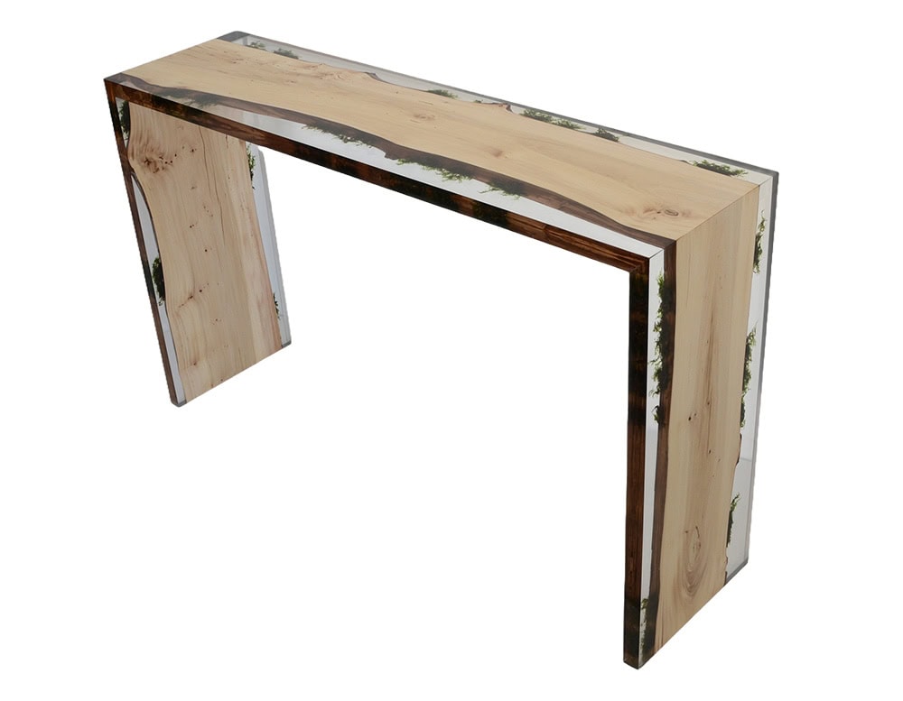 Trail Console showcases smooth wood panels framed in transparent resin, creating a refined silhouette. Its clean lines and natural grain merge into an elegant contemporary accent piece.