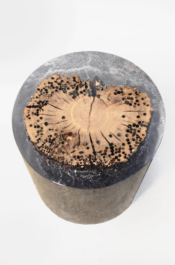 Fisheye Stool/Side Table with a rounded shape, made of solid wood with a natural finish, set against a white background.