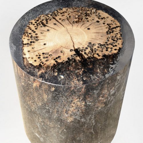 Fisheye Stool/Side Table with a rounded shape, made of solid wood with a natural finish, set against a white background.