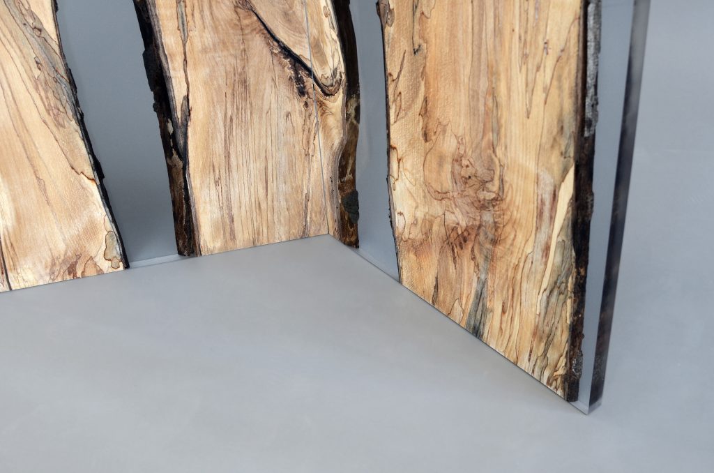 Closeup of Fungi Screen with an organic design, made of wood with a natural finish and featuring transparent resin inlays, set against a white background.