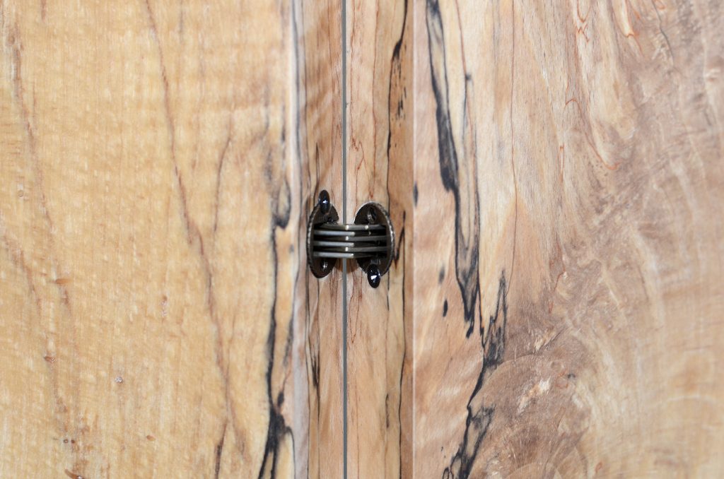 Closeup of Fungi Screen with an organic design, made of wood with a natural finish and featuring transparent resin inlays, set against a white background.