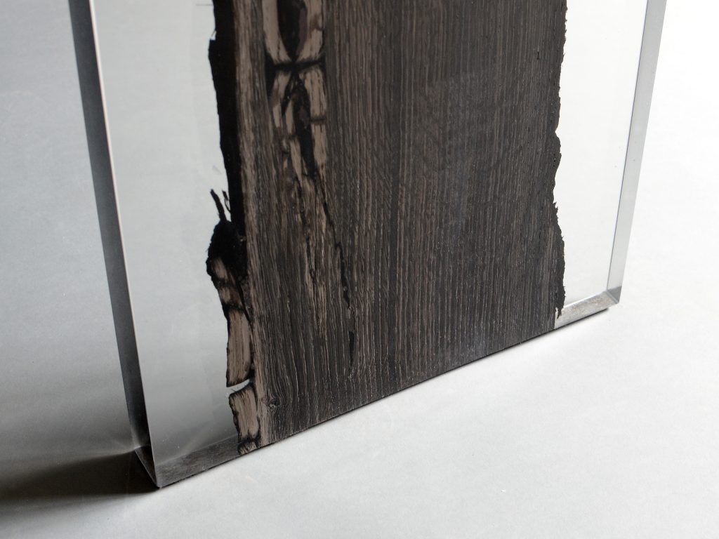 Closeup of Peatland Bench/Low Table with a rectangular shape, featuring a natural wood finish and clean lines, set against a white background.
