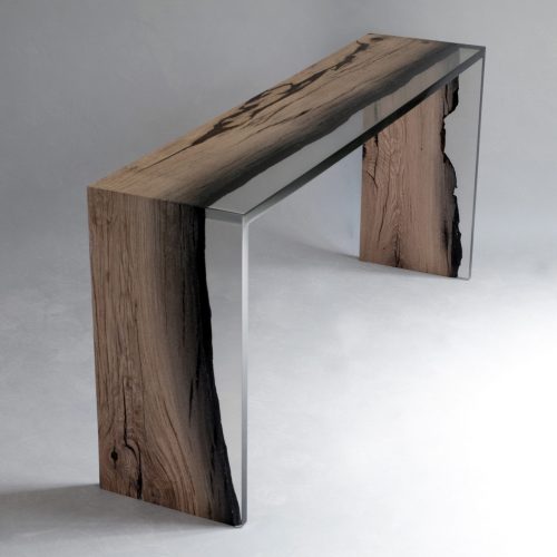 console made of roeble wood base coated in resin on a gray background