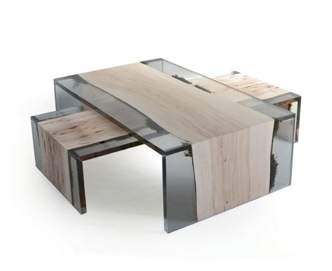 a coffee table on top of each other in resin and wood base in a light color tone on a white background