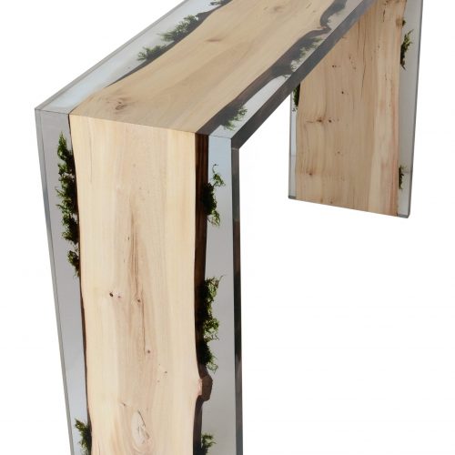 table console made of light wood with edges made of alcarol resin based on a natural tree