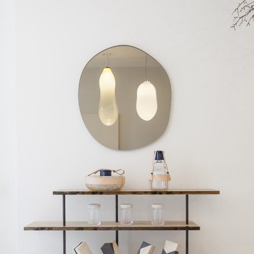 three-story table made of natural wood, resin and steel in a light brown tone