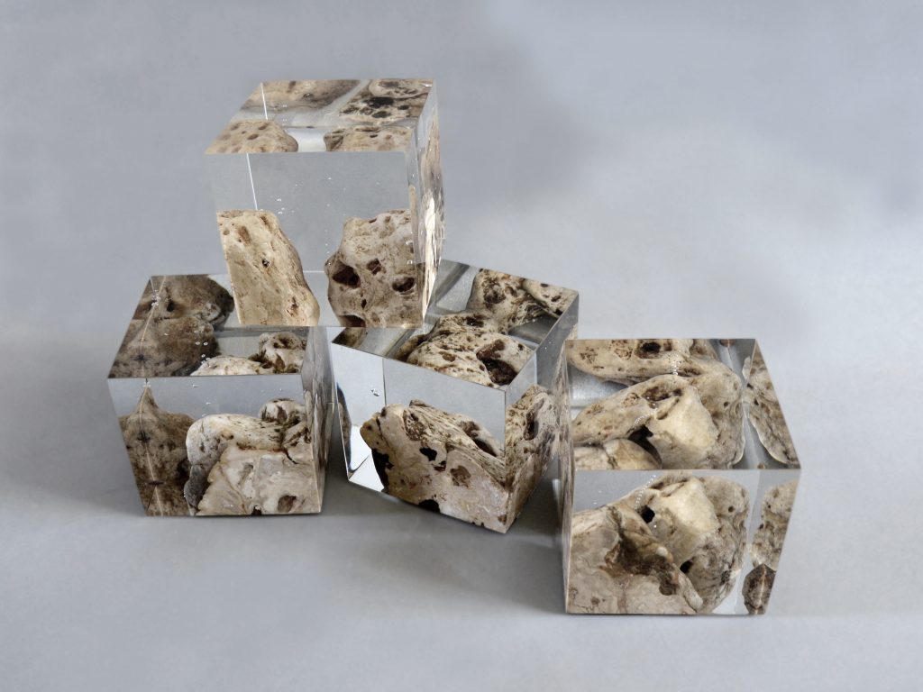 Four Karst Bookends with a geometric design, featuring a natural stone finish, set against a white background.