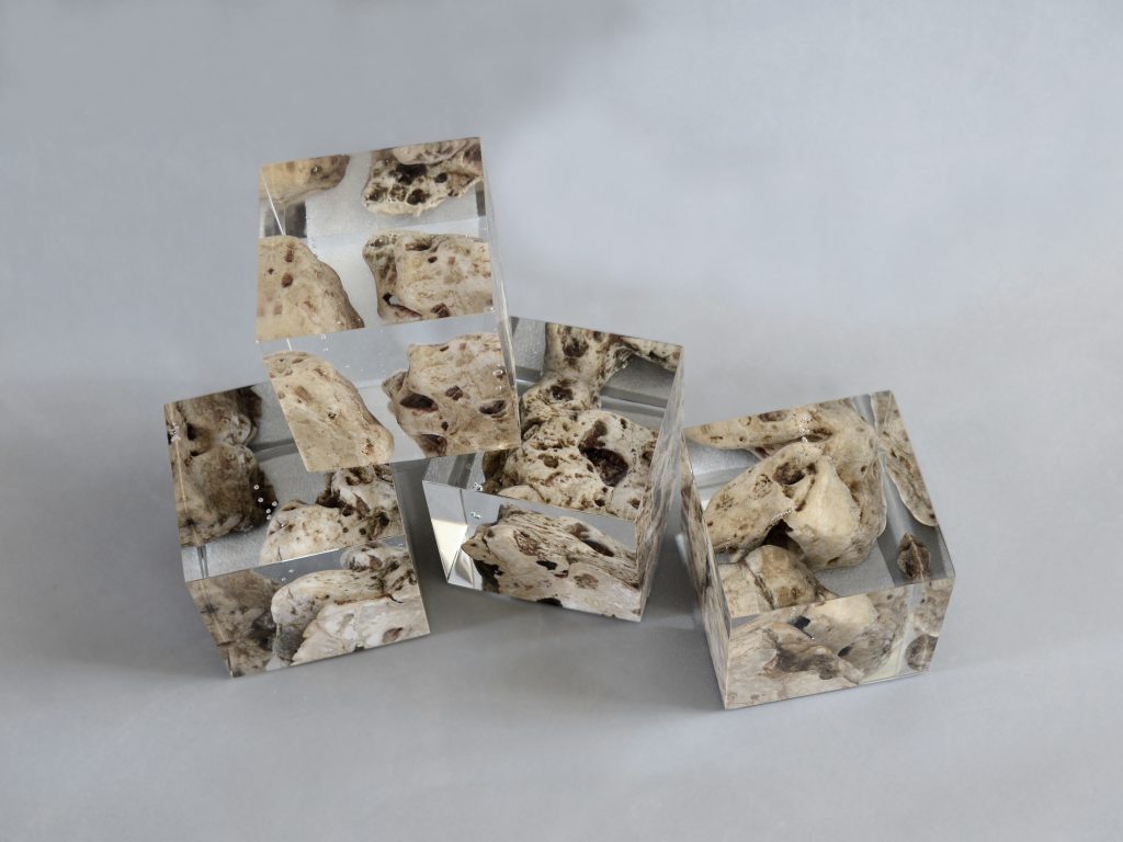 Four Karst Bookends with a geometric design, featuring a natural stone finish, set against a white background.