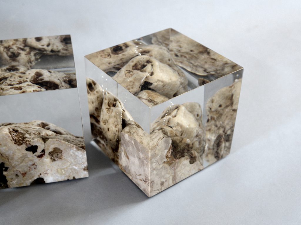 Two Karst Bookends with a geometric design, featuring a natural stone finish, set against a white background.