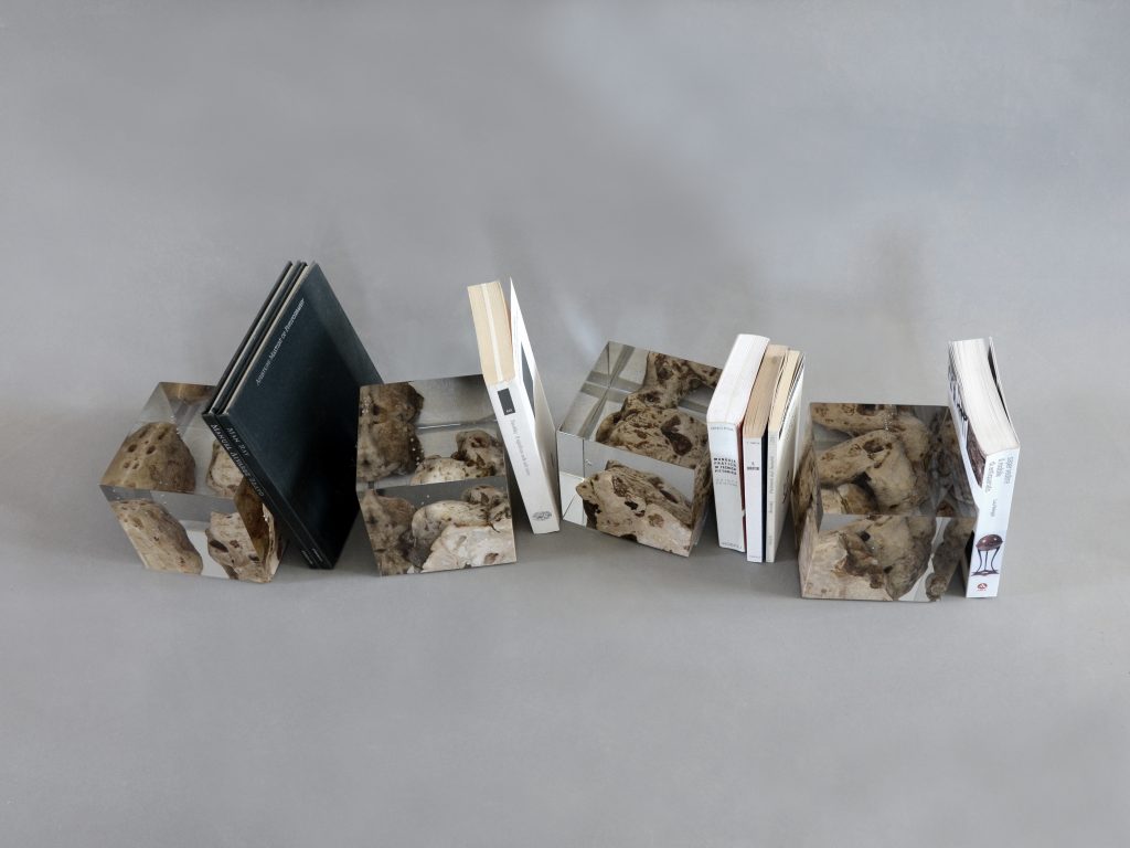 Four Karst Bookends with a geometric design, featuring a natural stone finish, set against a white background.