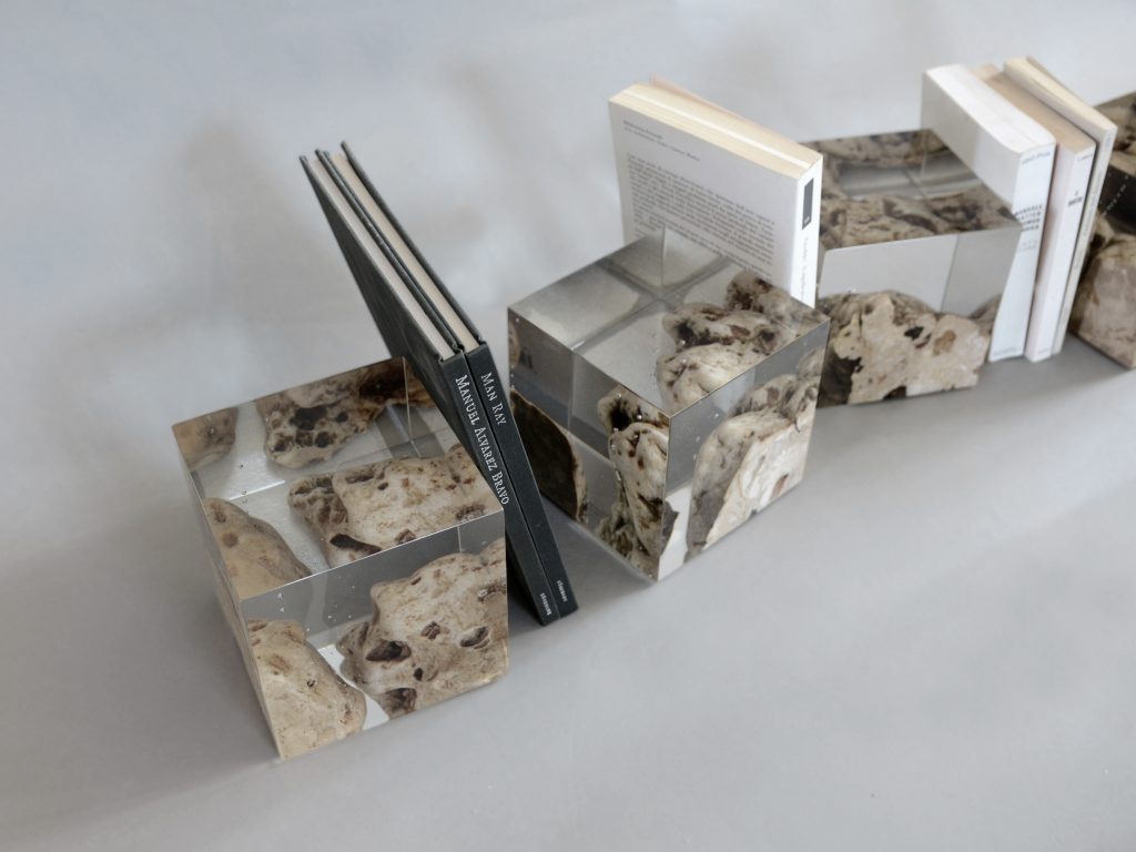 Four Karst Bookends with a geometric design, featuring a natural stone finish, set against a white background.