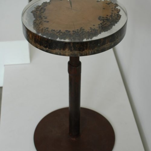 Mareale Stool with a round top and tapered legs, made of natural finish solid wood with a transparent resin inlay , set against a white background.
