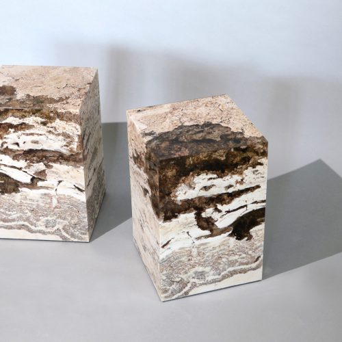 small sculpture made of natural stone covered in resin completely in a tone of brown and beige