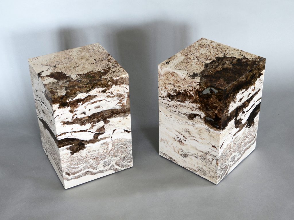 small sculpture made of natural stone covered in resin completely in a tone of brown and beige