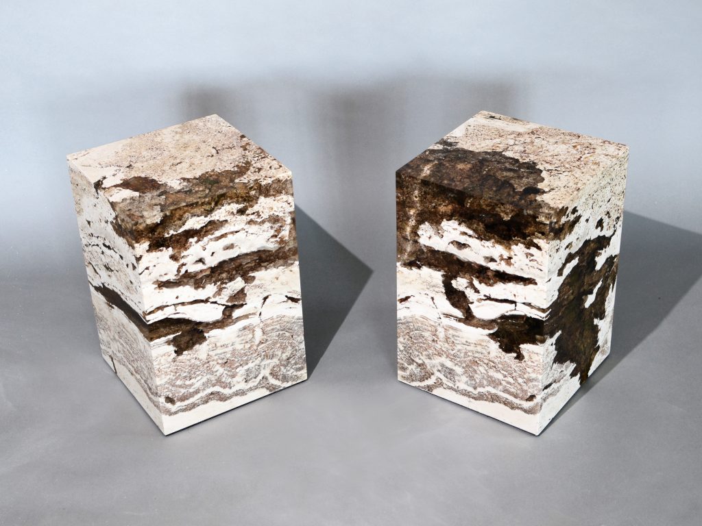 small sculpture made of natural stone covered in resin completely in a tone of brown and beige