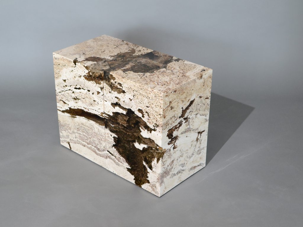 small sculpture made of natural stone covered in resin completely in a tone of brown and beige