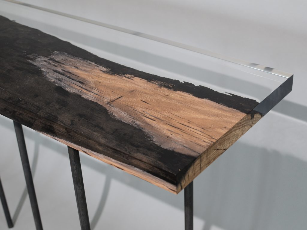 bar table made of resin and natural wood in a brown and transparent tone