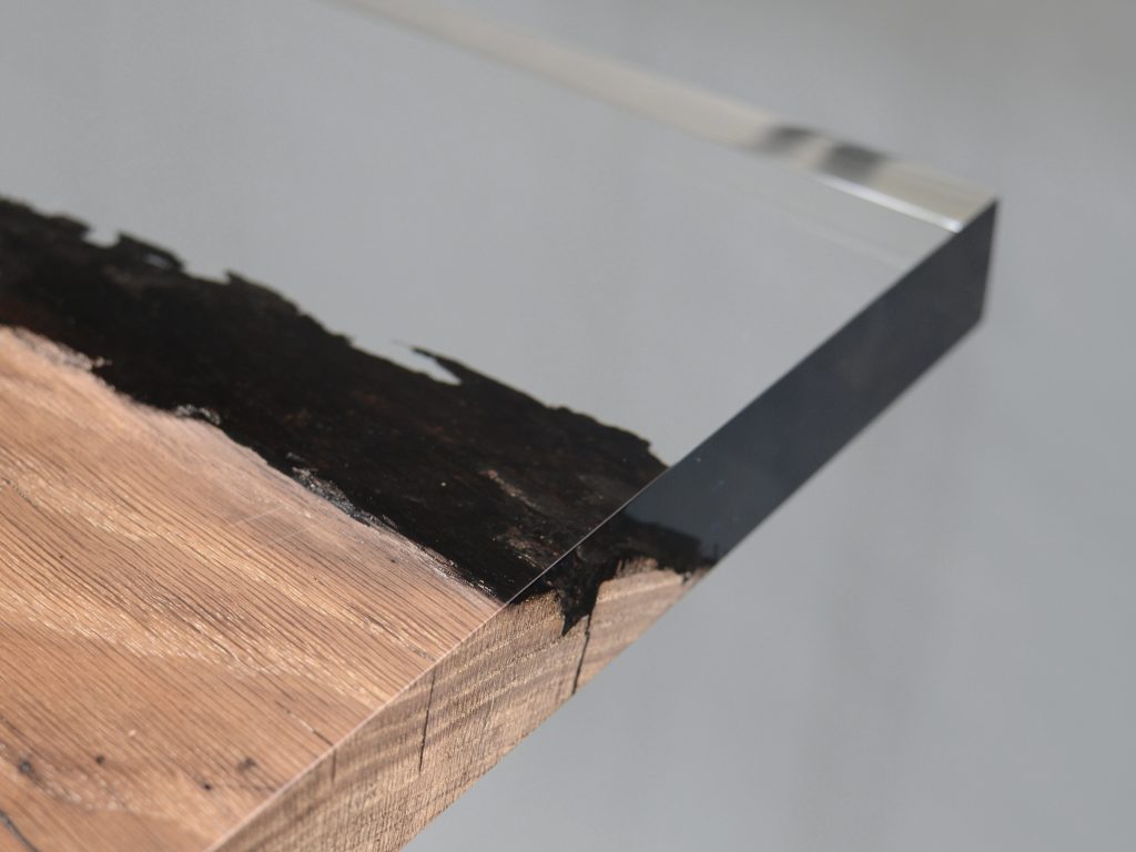 bar table made of resin and natural wood in a brown and transparent tone