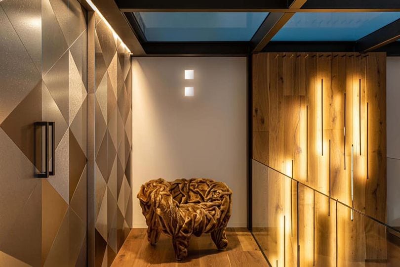 Grinza Chair with distinctive wrinkled leather texture in a warm, ambient setting