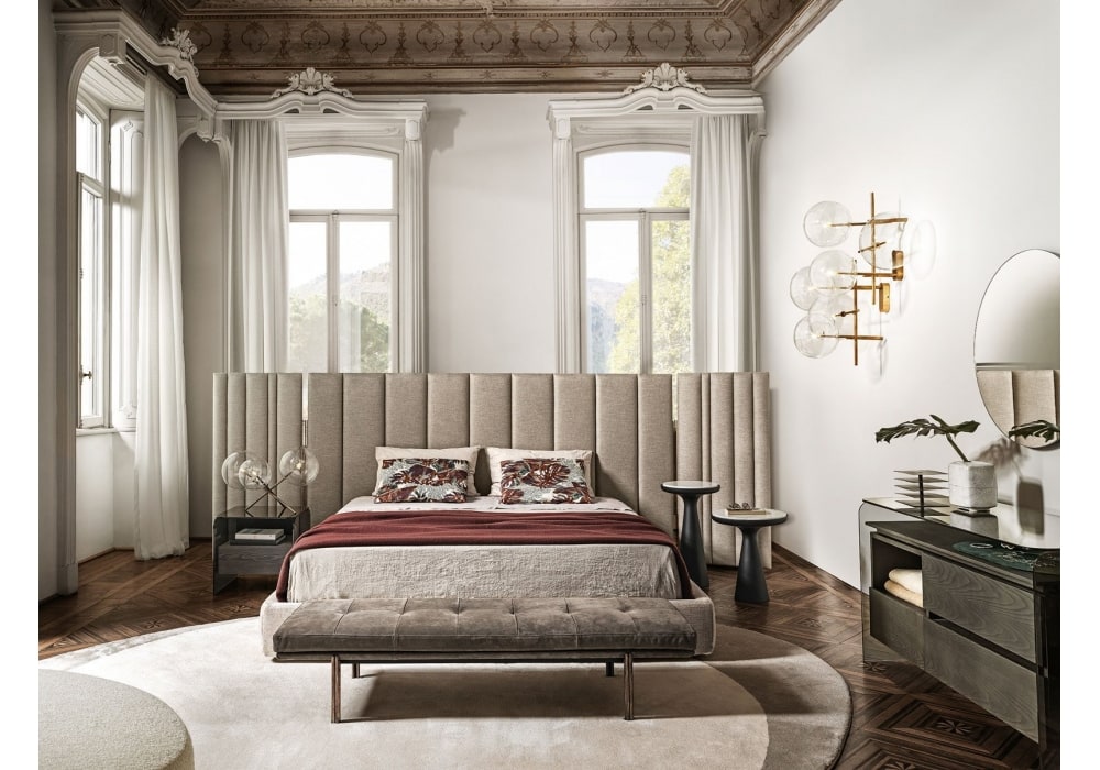 Yuki Gallottiradice Bed in a luxurious bedroom with high ceilings, intricate molding, and soft neutral tones, featuring elegant furnishings and warm lighting