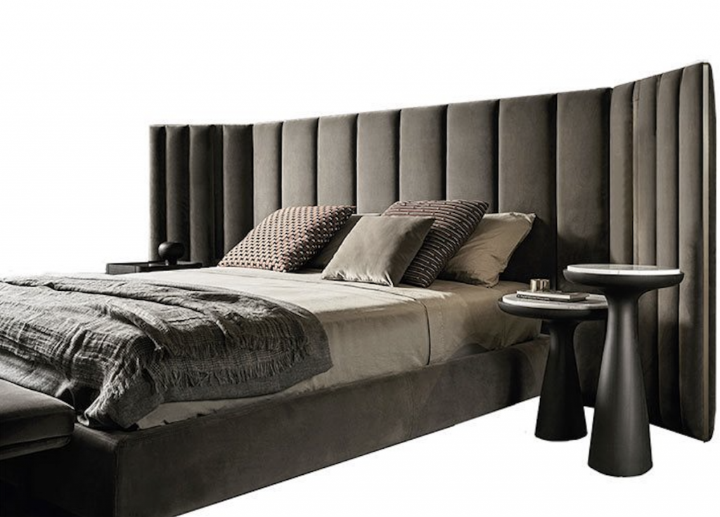 Yuki bed with gray lines headboard and upholstered base in gray fabric on a gray background.