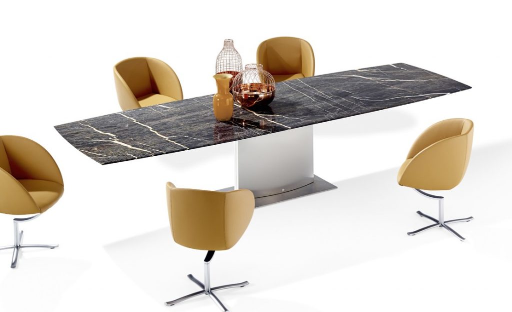 dining table made of white wood and rectangular marble top in a white tone