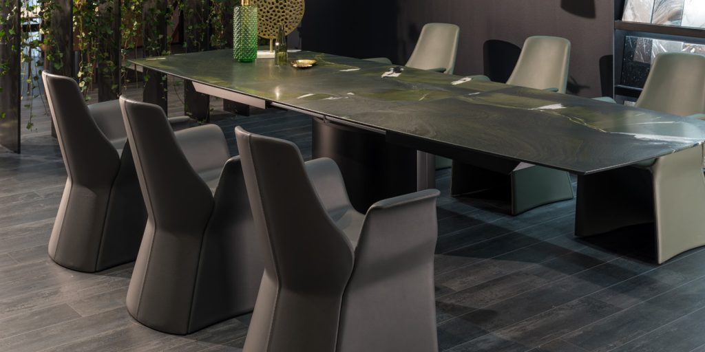 dining table made of white wood and rectangular marble top in a white tone in a room