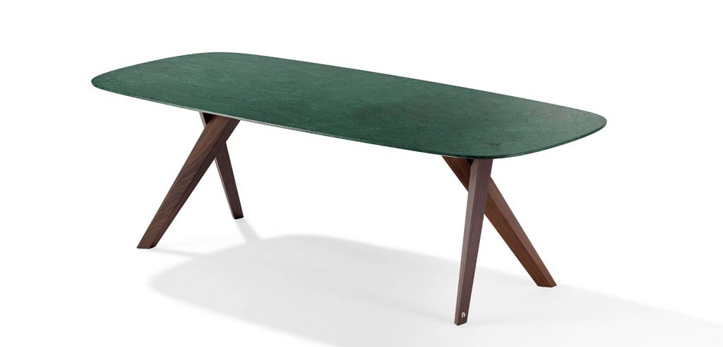 table made on the basis of wooden legs board made of lacquered wood in a dark green tone on a white background