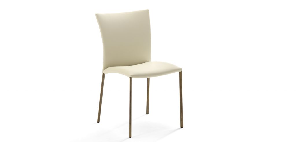 chair made on wooden legs upholstered in leather of a white tone on a white background