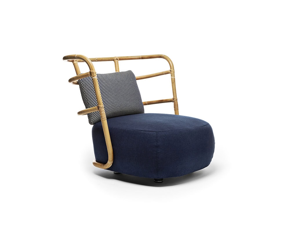 Jungle Armchair Slim upholstered in blue fabric and brown wooden structure on a white background.